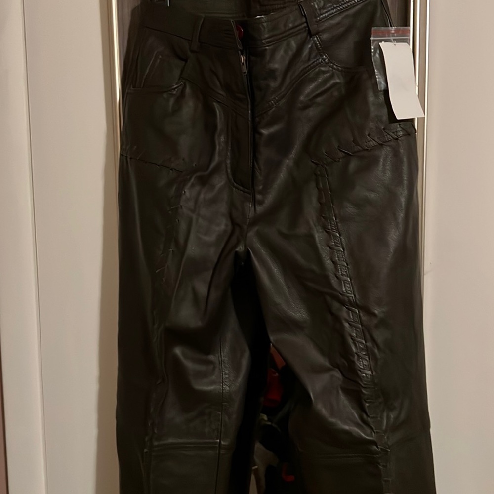 Never worn 100% leather pants with stitch detail.